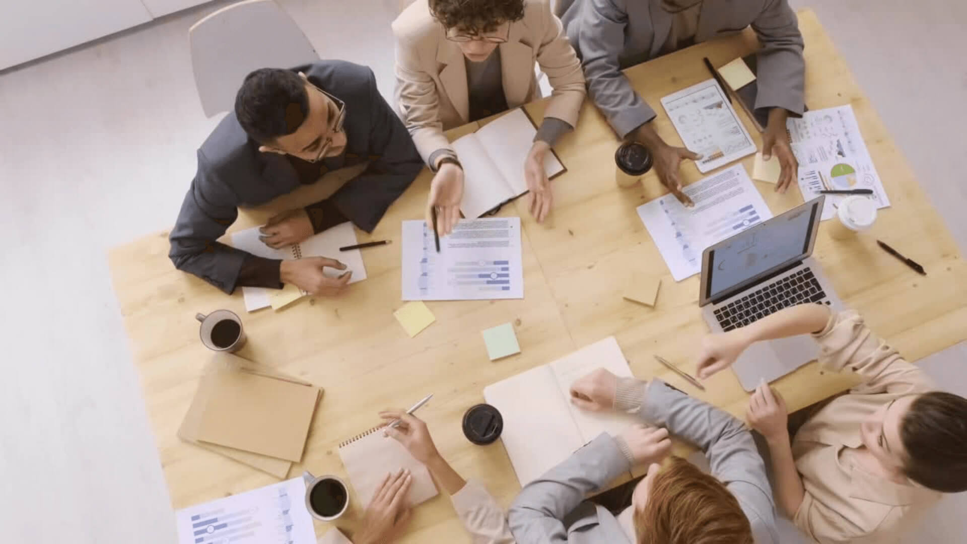 Hero people meeting at a table